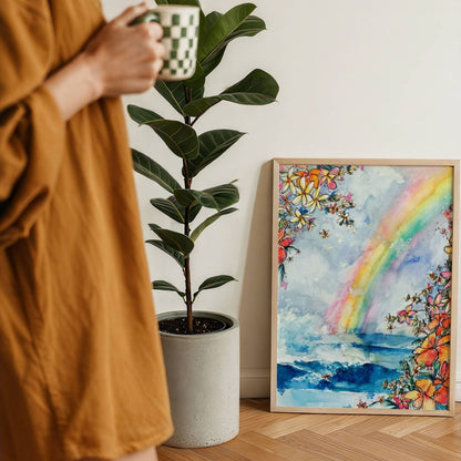 Wave Under the Rainbow watercolour surf art print by Rebekah Steen framed and leaning on the floor
