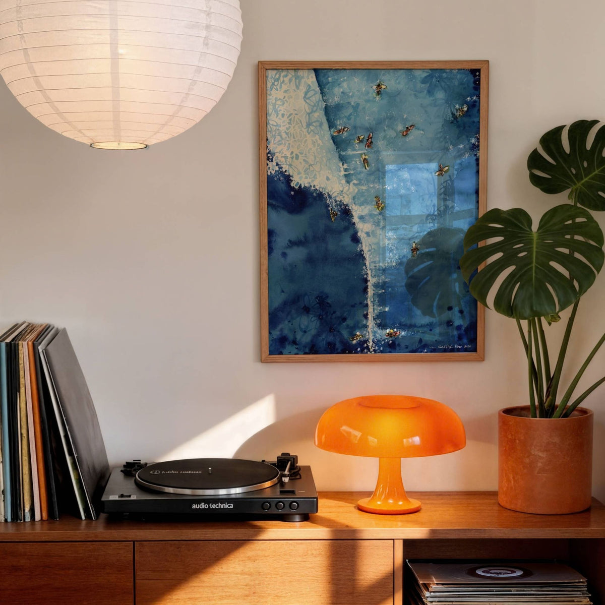 Above The Set watercolour surf art print by Rebekah Steen displayed in a living room