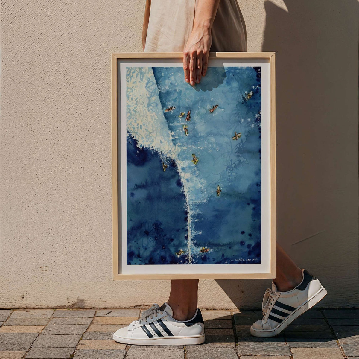 Above The Set watercolour surf art print by Rebekah Steen in a wood frame
