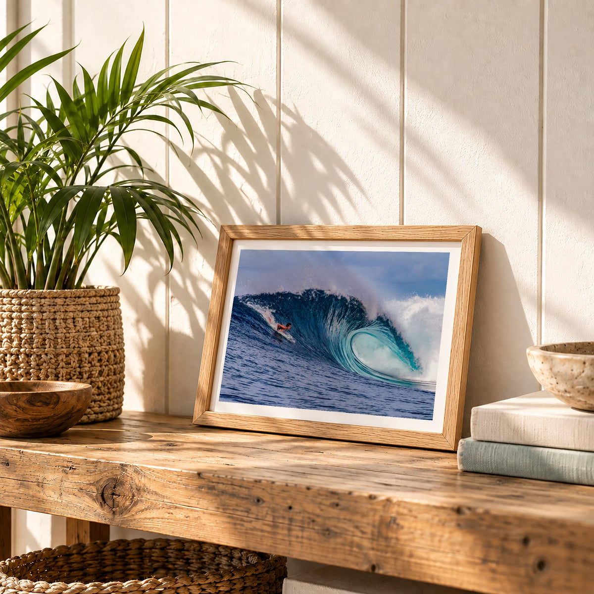 Small Almond Tubes surf photography print by John Seaton Callahan with a white border, in a small frame on a wooden bench with plants