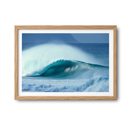 Aqua Plume surf photography print by Sean Davey in a natural wood frame