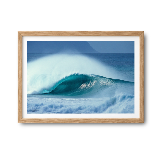 Aqua Plume surf photography print by Sean Davey in a natural wood frame