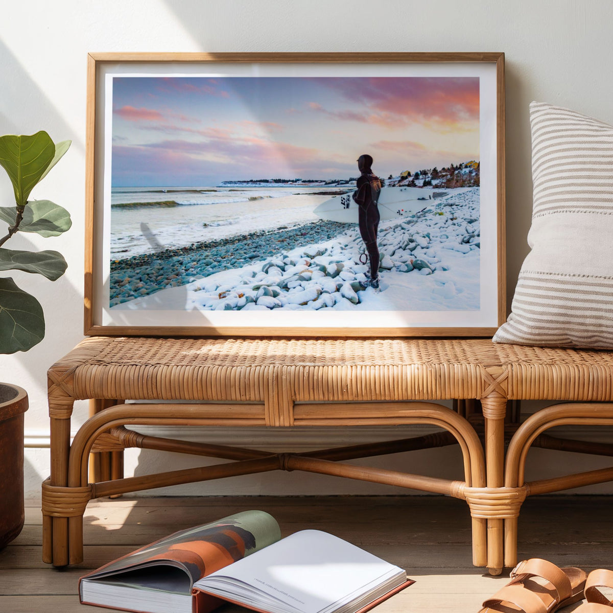 Chilled Vibes winter surf photography print by Adam Cornick framed above a bench in a hallway
