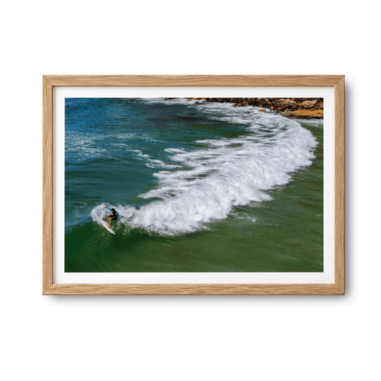 Right-Hand Point, Brazil surf photography print by Douglas Schneiders framed beside a table