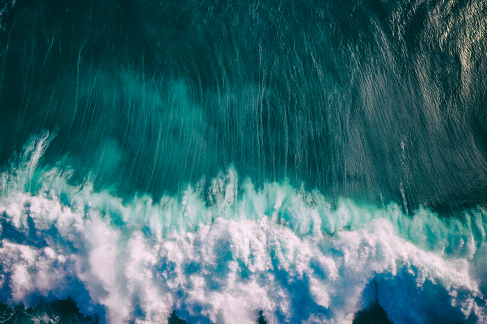 Aerial drone photograph of a wave by Jason Childs