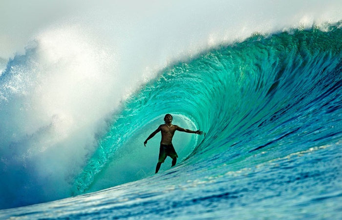 Surfer in the barrel in Indonesia, photographed by Jason Childs
