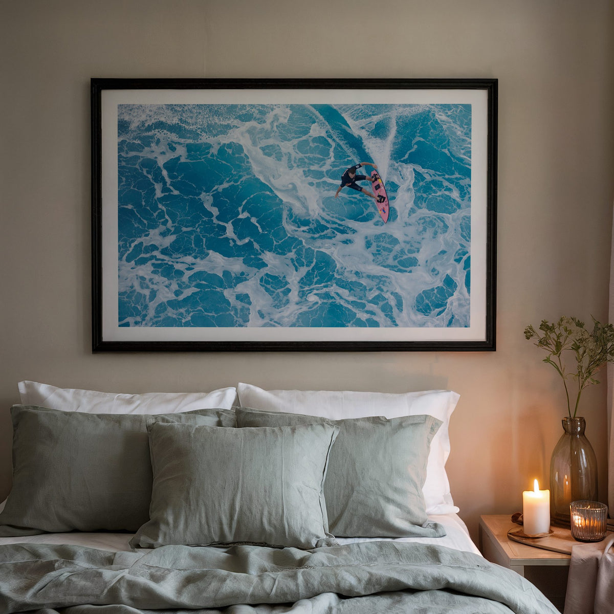 Marble Carve surf photography print with a white border by Sean Davey in a black frame above a bed
