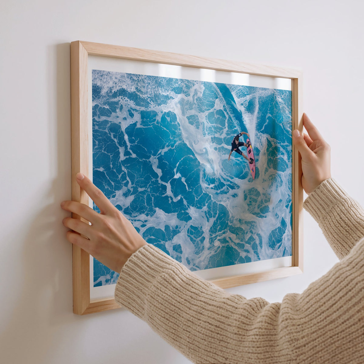Marble Carve surf photography print with a white border by Sean Davey being hung on a wall
