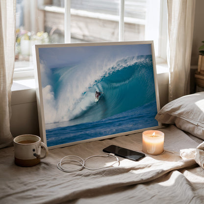 Perfection surf photography print by Sean Davey framed on a bed by a sunny window
