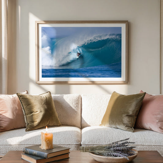 Perfection surf photography print by Sean Davey framed above a sofa in a living room