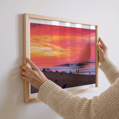 Pipeadelic surf photography print with a white border by Sean Davey being hung on a wall