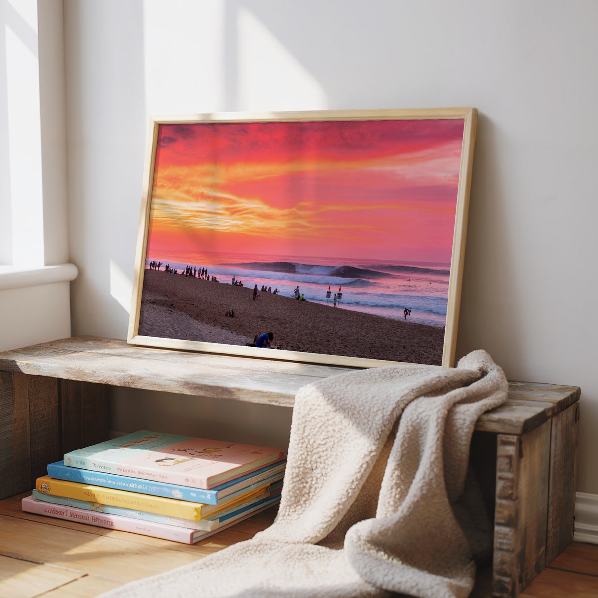 Pipeadelic surf photography print by Sean Davey framed and leaning on a window bench with books