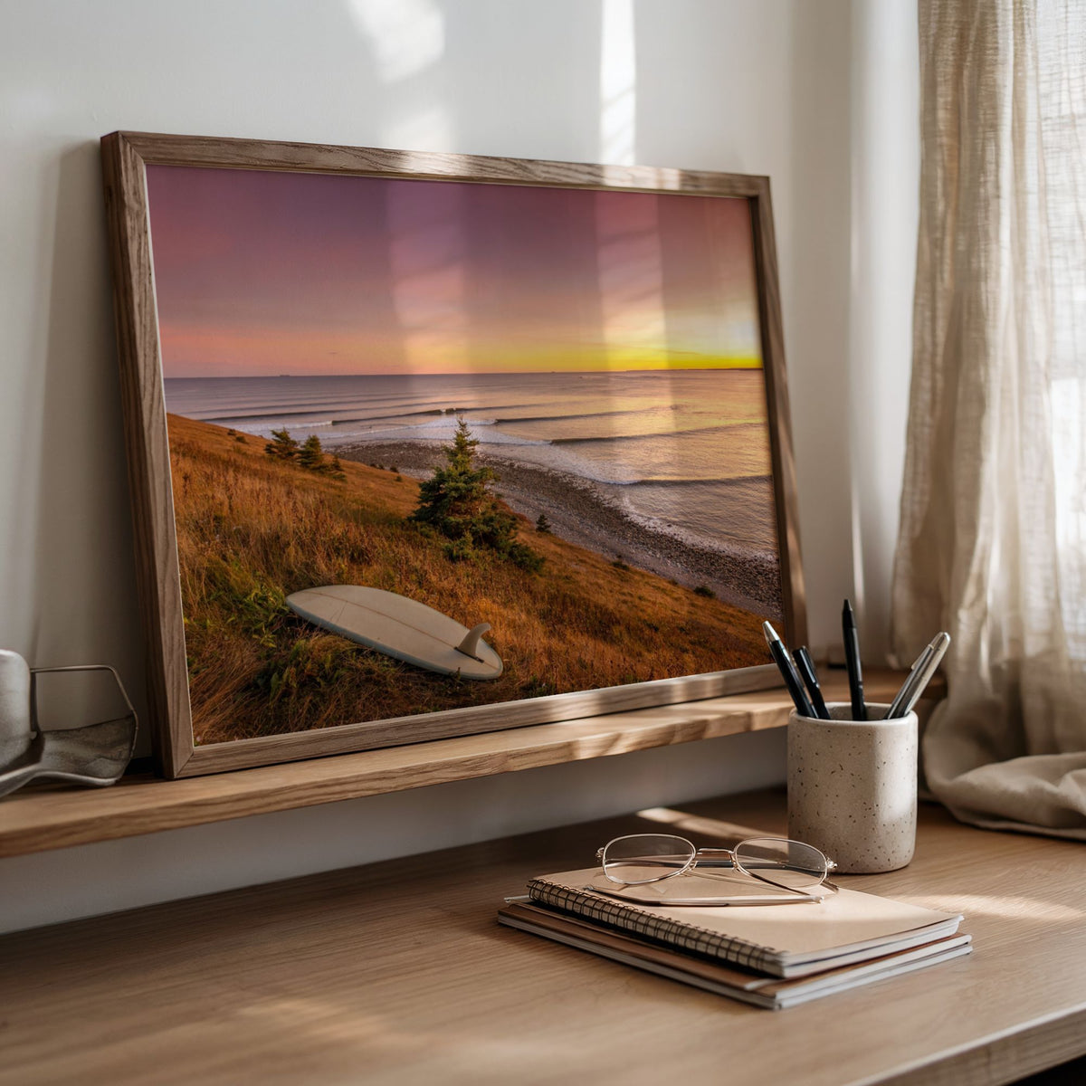 Rolling Lines surf photography print by Adam Cornick framed and leaning on a desk