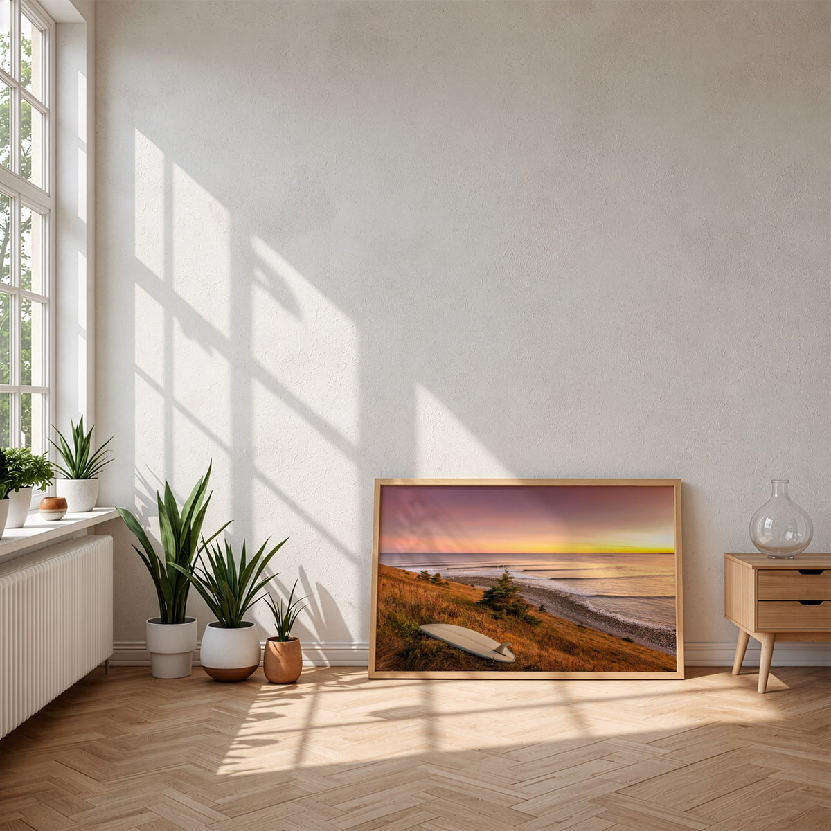 Rolling Lines surf photography print by Adam Cornick framed and leaning on the floor in morning sunlight