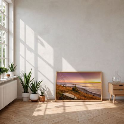 Rolling Lines surf photography print by Adam Cornick framed and leaning on the floor in morning sunlight