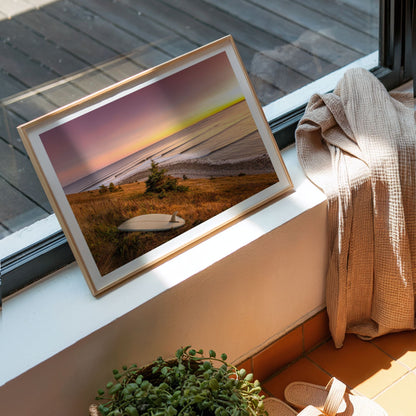 Rolling Lines surf photography print by Adam Cornick framed on a window ledge