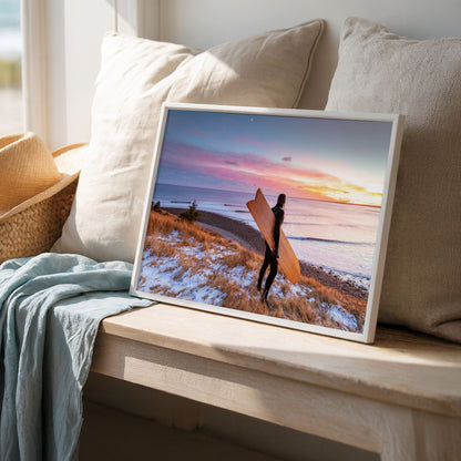 Snow and Sunrise winter surf photography print by Adam Cornick framed on a window seat