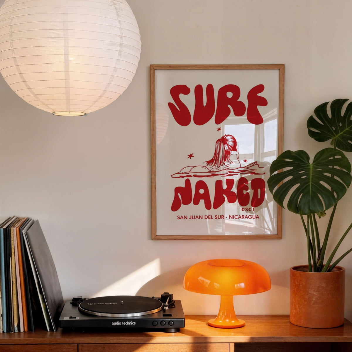 Surf Naked surf illustration print by Osci displayed in a retro-style room