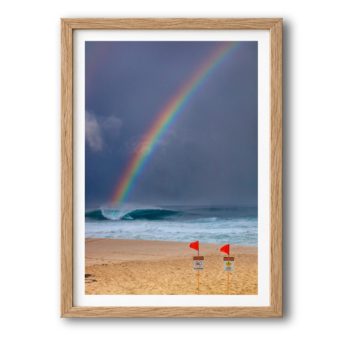 Surfing the Rainbow surf photography print by Sean Davey in a natural wood frame