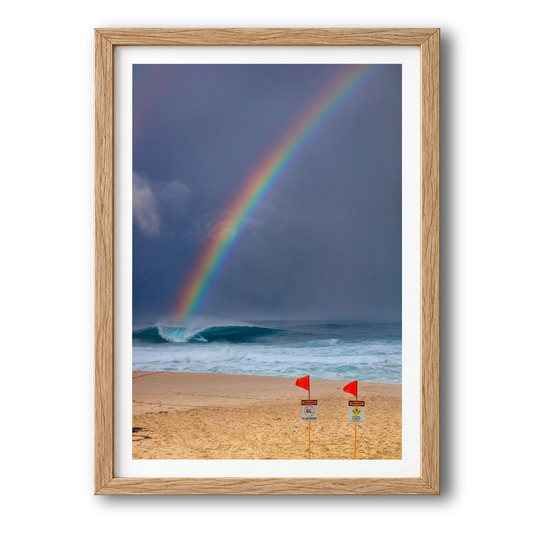 Surfing the Rainbow surf photography print by Sean Davey in a natural wood frame
