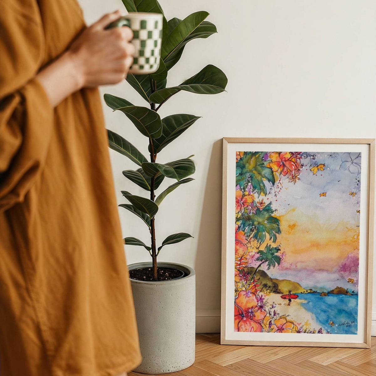 The Red Board watercolour surf art print by Rebekah Steen displayed beside a coffee
