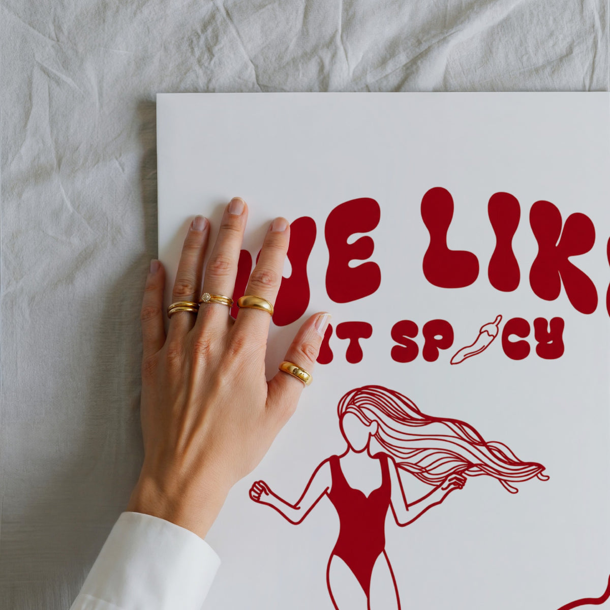 We Like It Spicy surf illustration print by Osci held in a hand